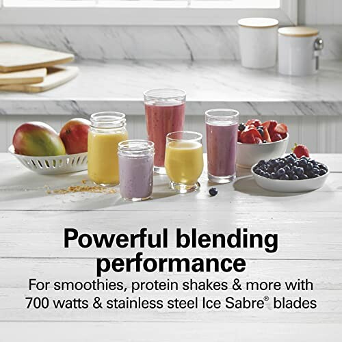 Various fruit smoothies in glasses on a countertop with blending performance text.