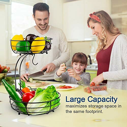 Family cooking in kitchen with a large two-tier fruit and vegetable basket.