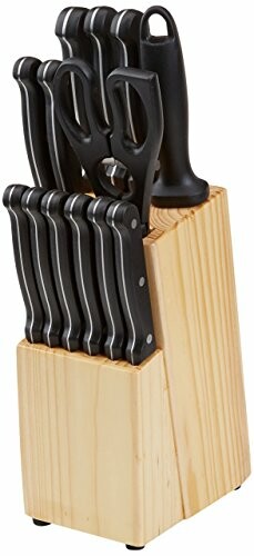 Knife set with wooden block including scissors and sharpener.